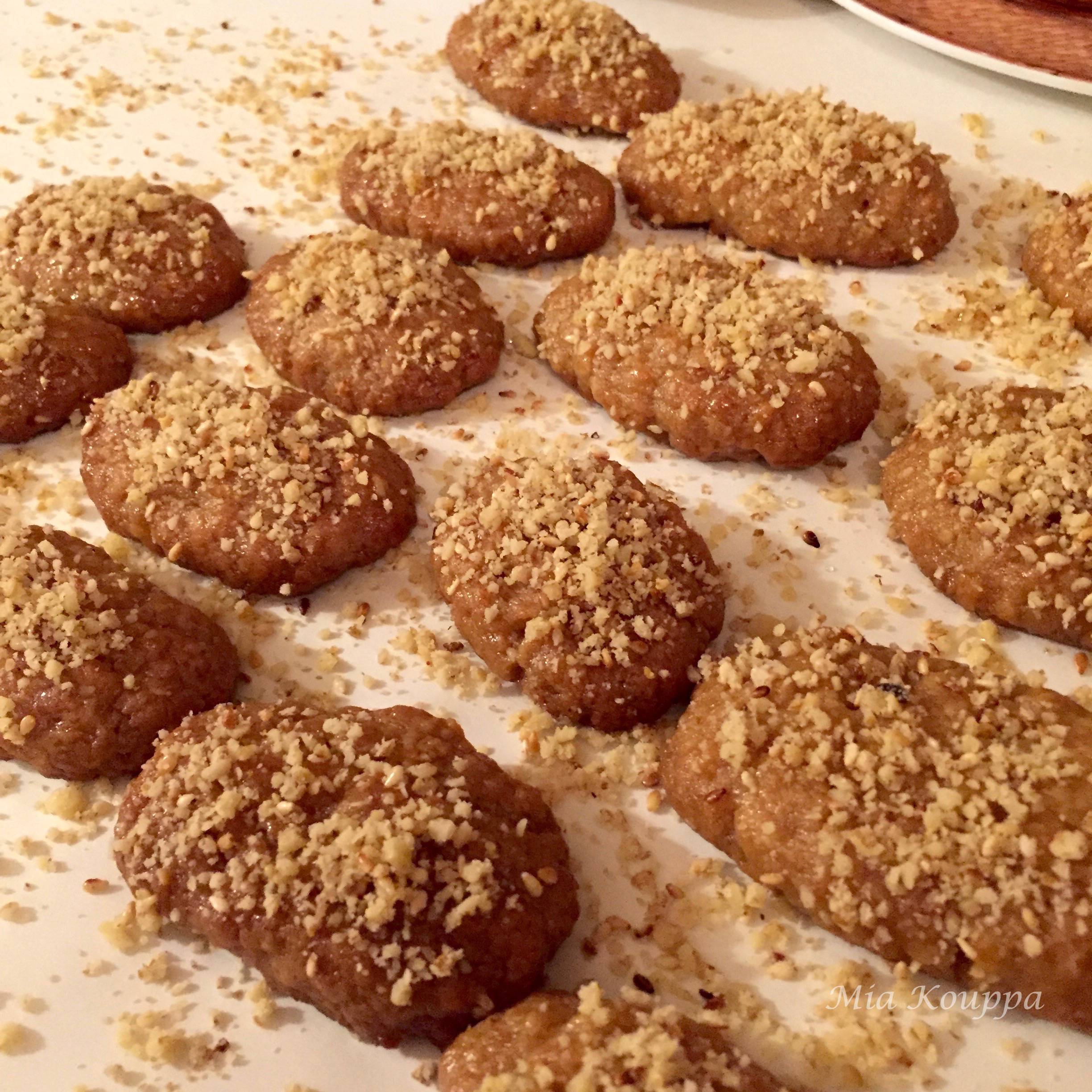 Melomakarona Greek cookies. These deliciously spiced, honey soaked, walnut topped Greek cookies just melt in your mouth.