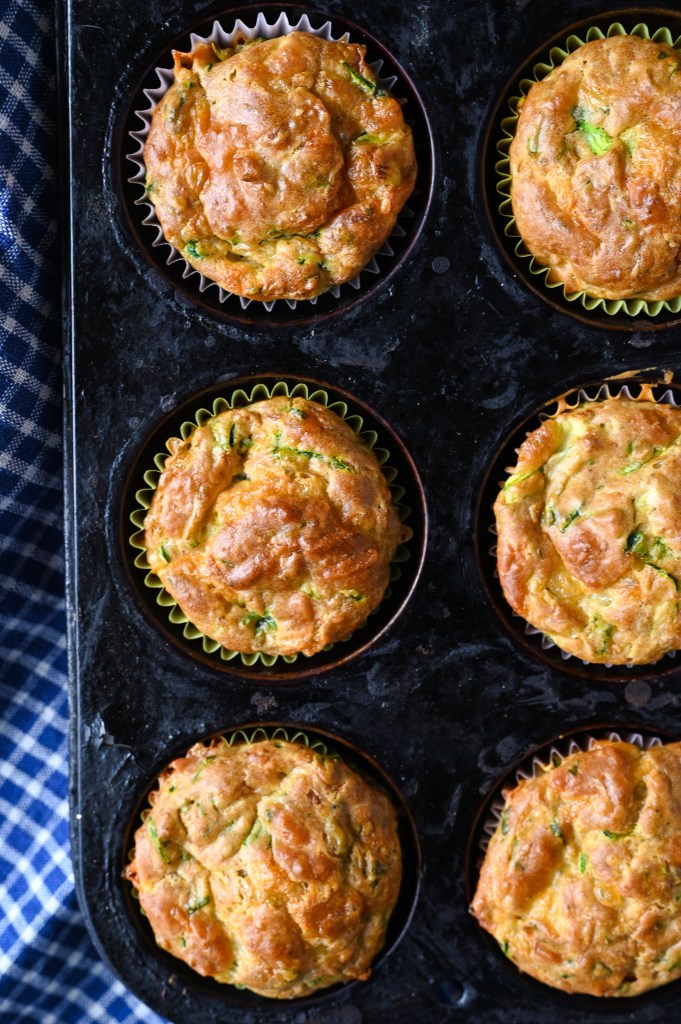Savoury zucchini and cheddar muffins made with summer squash, aged cheddar and fresh herbs