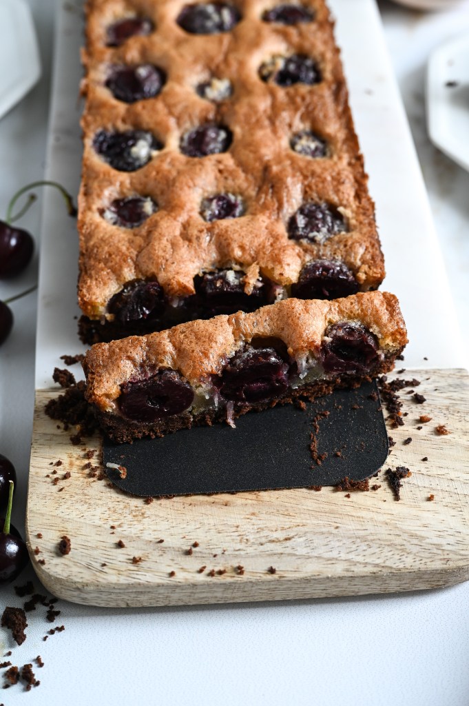 A cherry and coconut brown butter tart with a chocolate crust - pure decadence!