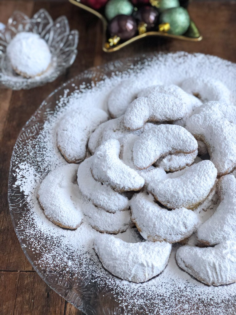 Kourabiethes (kourabiedes) are a Greek almond shortbread type cookie that is coated in icing sugar.