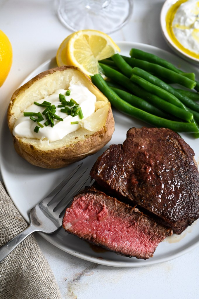 Learn how to make the best pan-seared and roasted filet mignon with herbed butter baste.