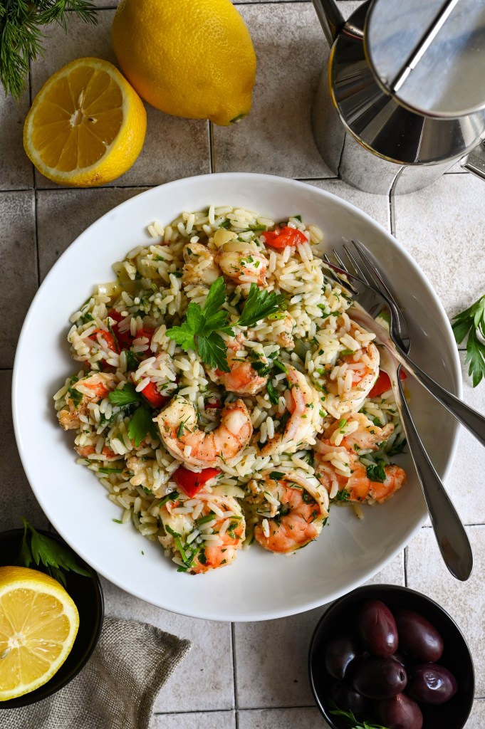 A one skillet meal of shrimp and rice full of vegetables and herbs.