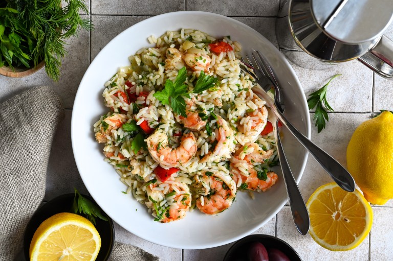 A one skillet meal of shrimp and rice full of vegetables and herbs.