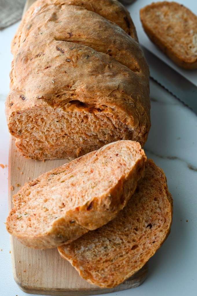 A lovely loaf of bread made with roasted red peppers and flavoured with garlic and chives.