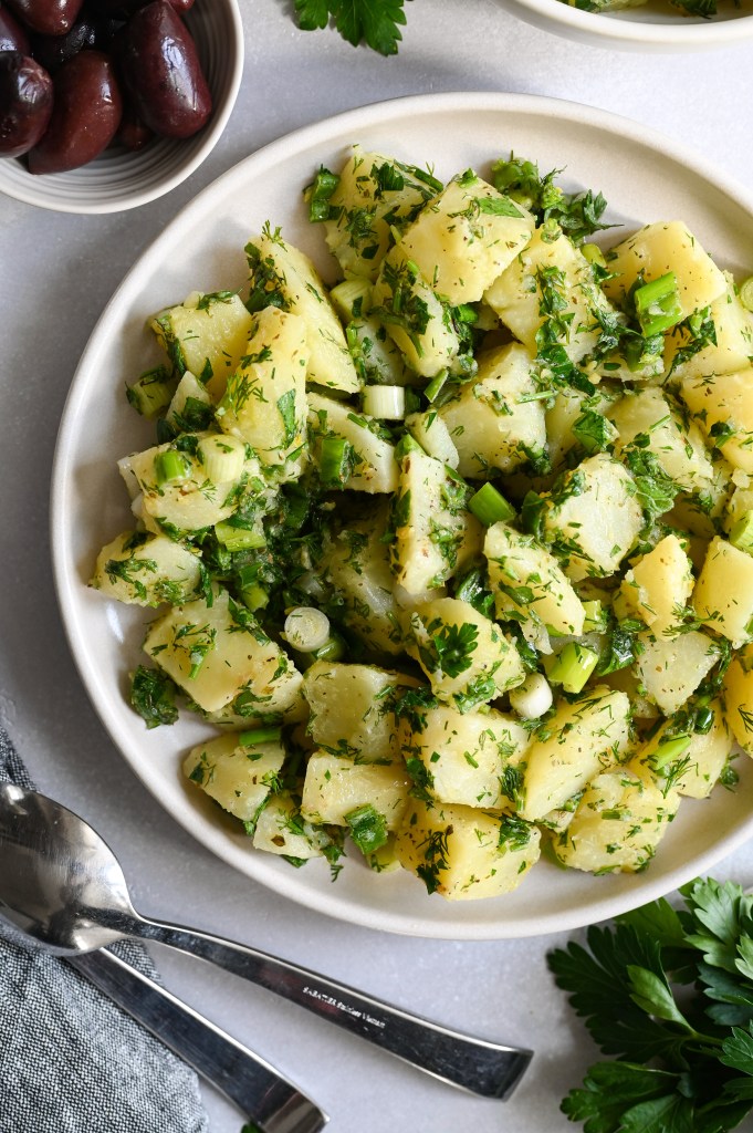 A Greek potato salad made with fresh herbs and a light lemon vinaigrette.