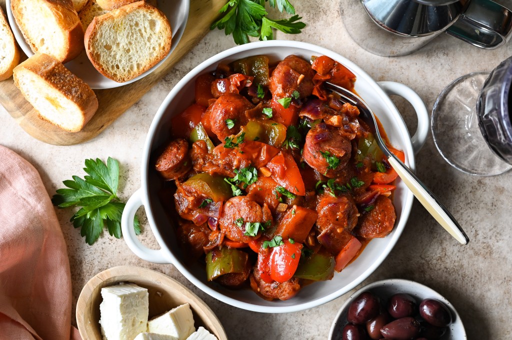 Traditional recipe for spetzofai (spetsofai) - Greek sausages with peppers and tomato recipe.