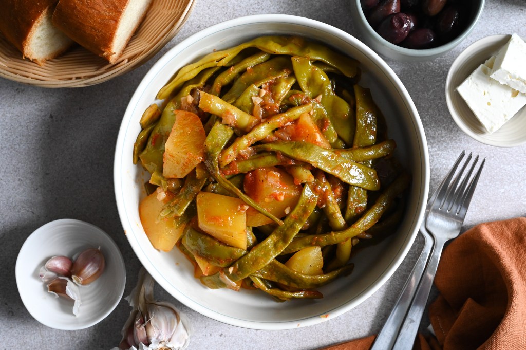 Vegan Greek green bean stew with potatoes and tomato.